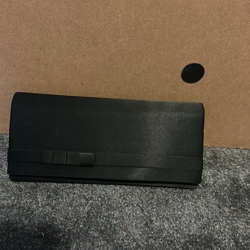 Gently used, good condition black clutch